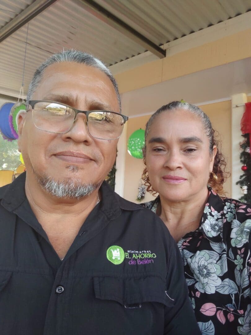 A man and woman standing next to each other.