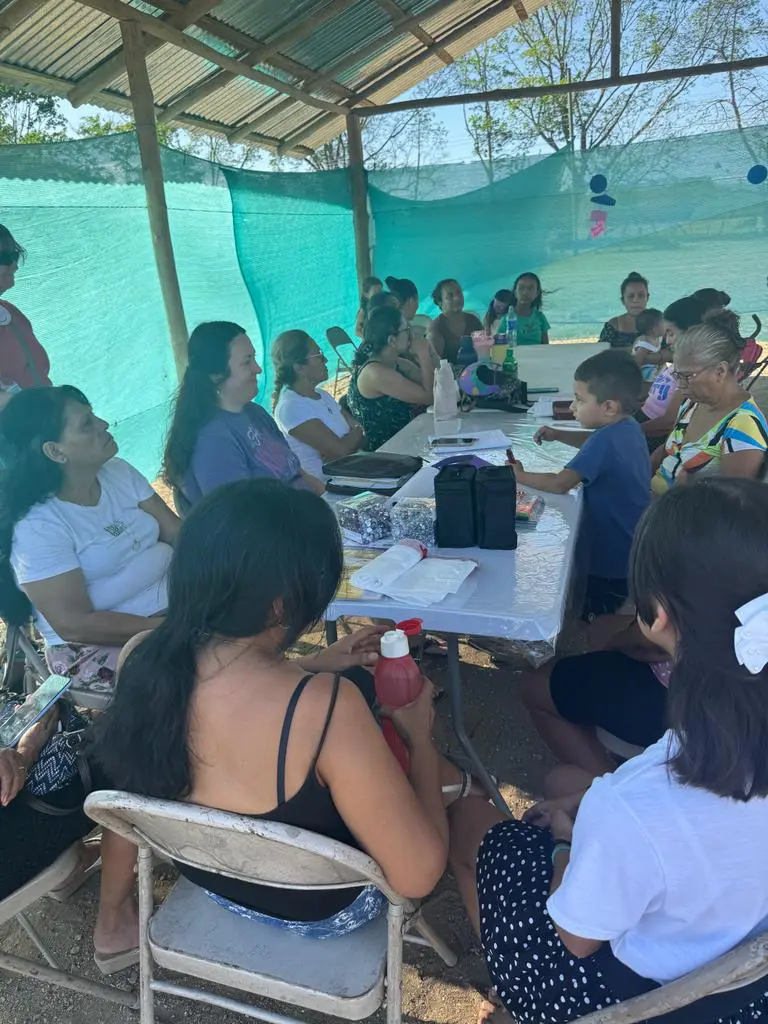 A group of people sitting around a table.